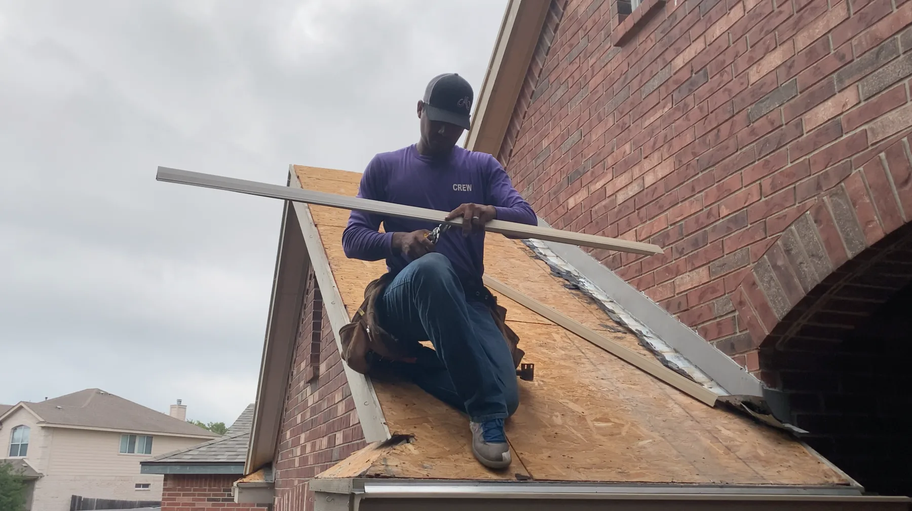 Mammoth roofer working at a brick chimney